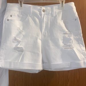 White jean shorts. Inseam is 4”